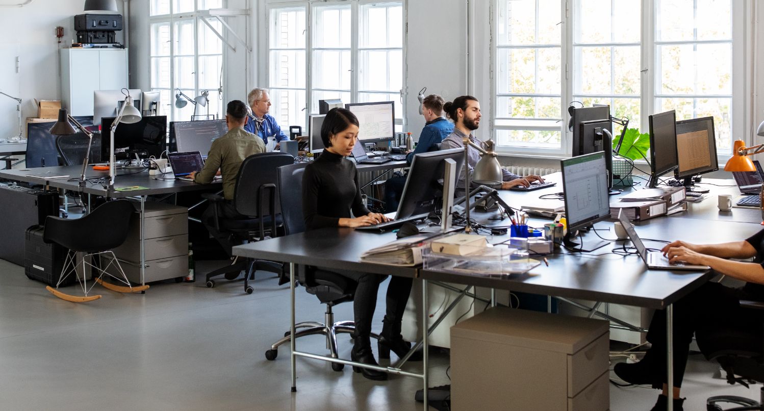 Image of people working in a modern office